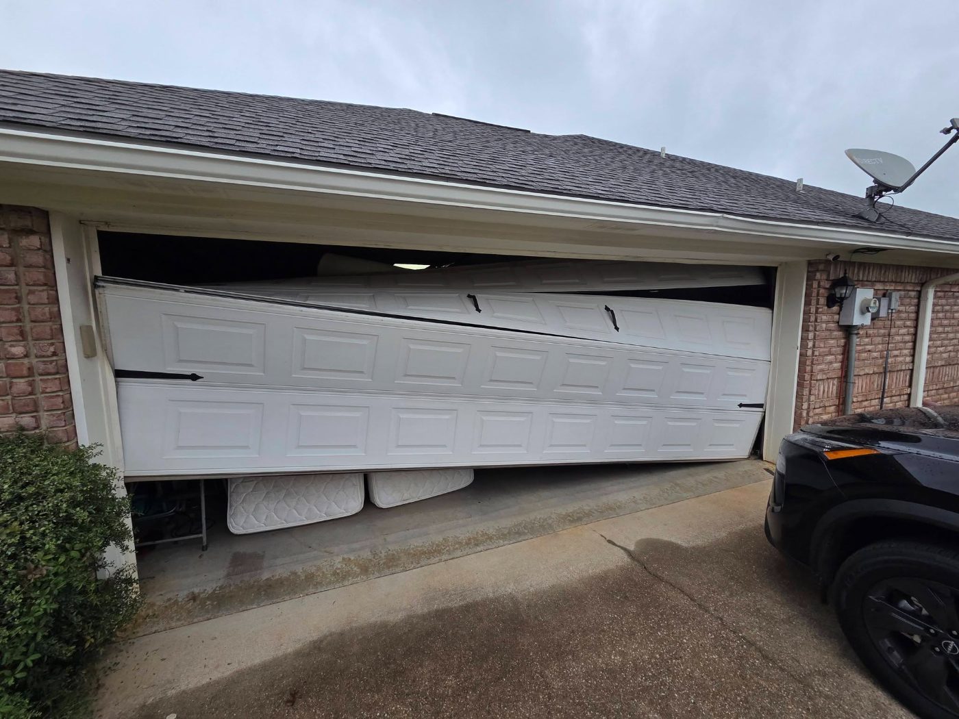 Garage door collapsed in the opening